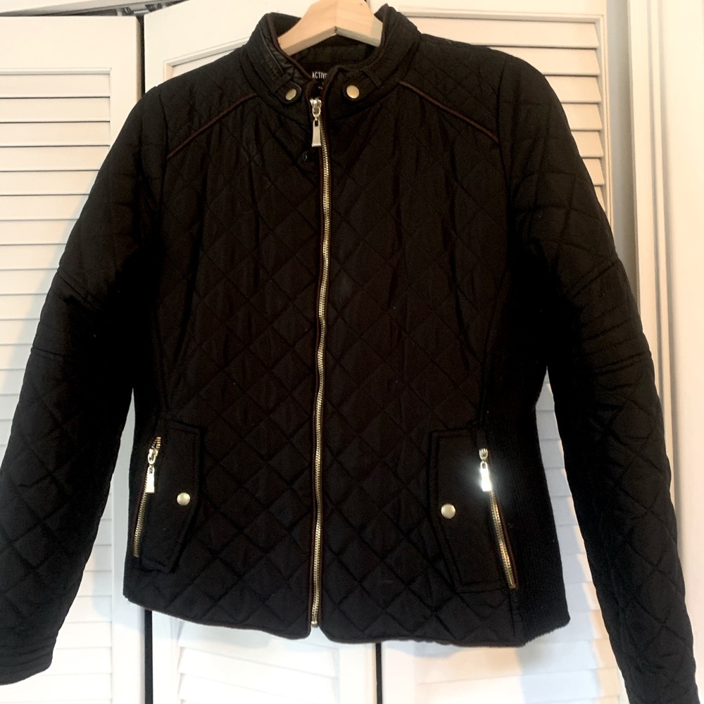 Black jacket with gold zipper and brown piping. Gently used.